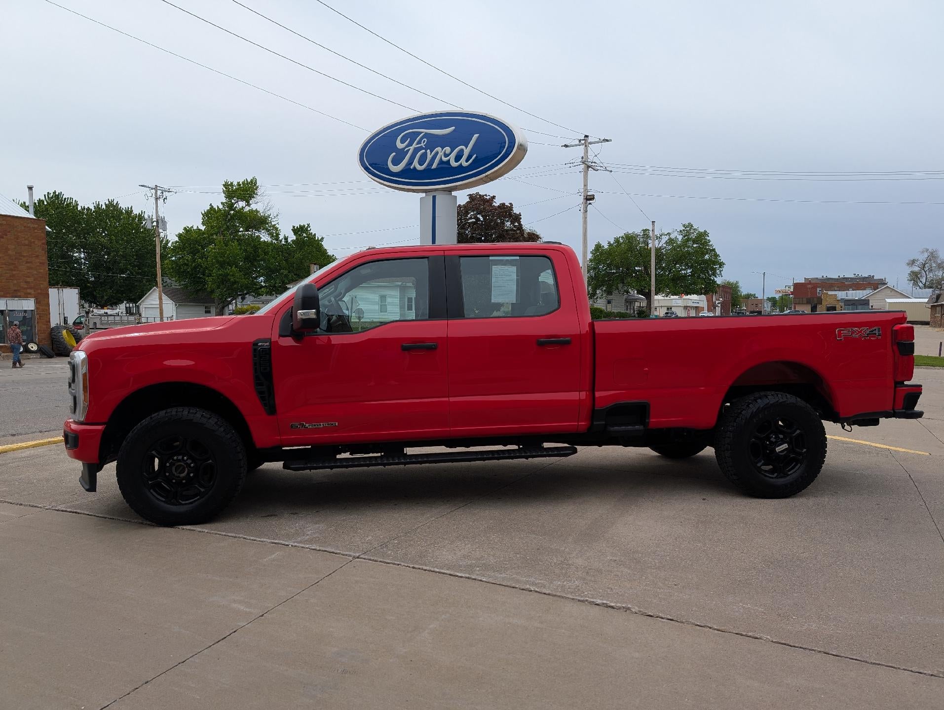 2023 Ford Super Duty F-350 SRW XL 4WD Crew Cab 8' Box in Race Red — front three-quarter view