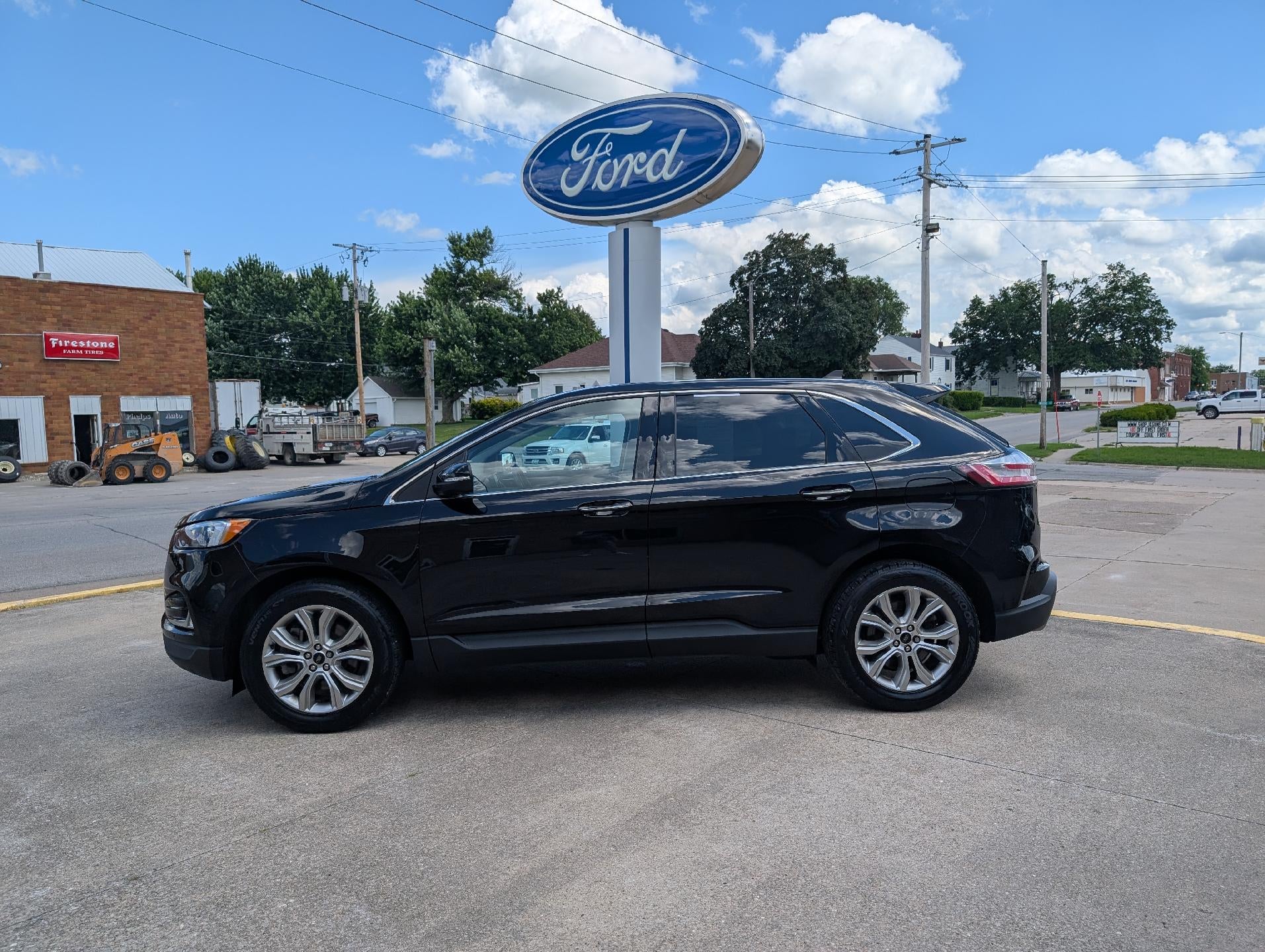 2023 Ford Edge Titanium AWD in Agate Black Metallic — front three-quarter view